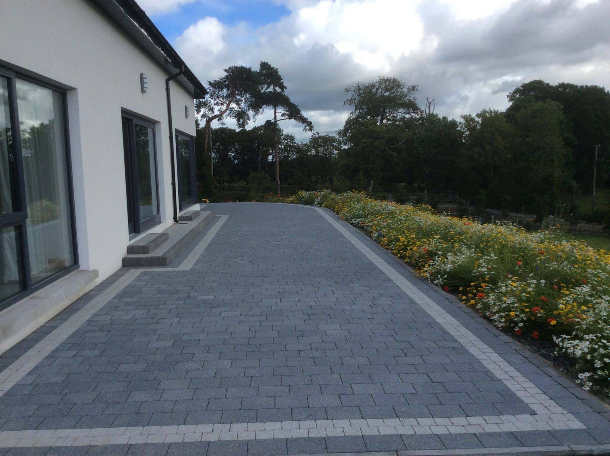 Newly paved driveway with decorative border